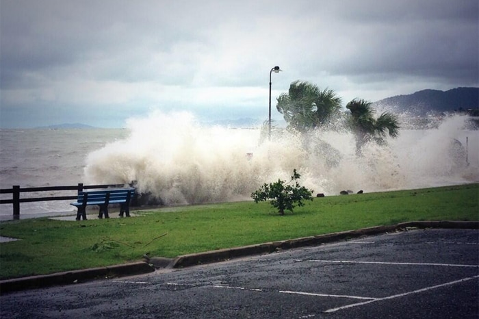 Waves splash over sea wall