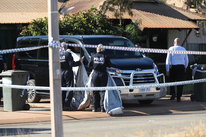 A van near police tape exits a house