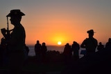 A soldier stands to attention during the Anzac Day dawn service at Torquay in Victoria.