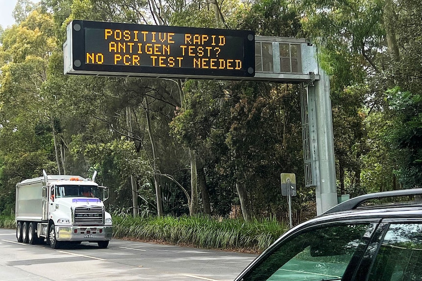 an electronic sign over a road