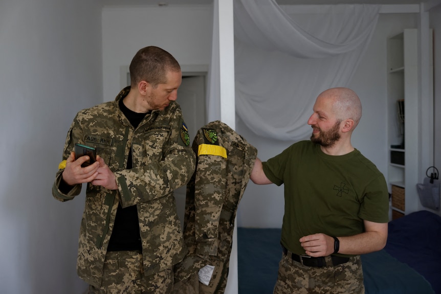 Antonina Romanova and Oleksandr Zhuhan get ready to go on a tour of duty. 