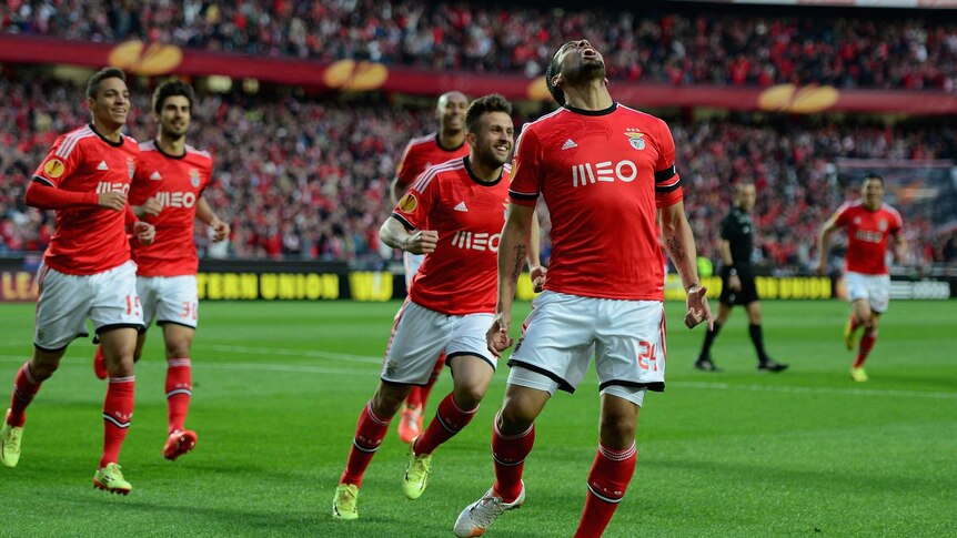 Early advantage ... Ezequiel celebrates his goal for Benfica