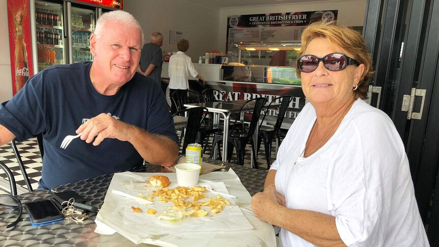 Diane and Brian Smith at cafe with fish and chips at Burleigh.