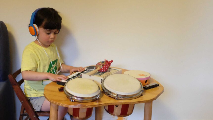 Four-year-old Miriam Zulfacar plays with her instruments