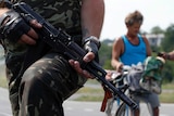 Pro-Russian rebels stand guard outside Donetsk