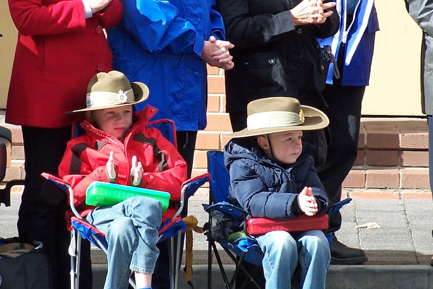 Young boys show their respect during Hobart's ANZAC day march