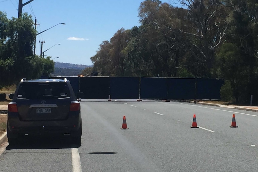 Police cordon off Springvale Drive, Weetangera after a fatal accident.