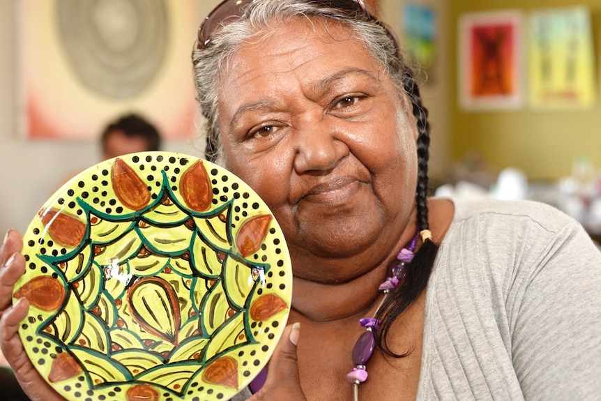 Cherbourg artist Venus Rabbitt with one of her ceramic pieces.