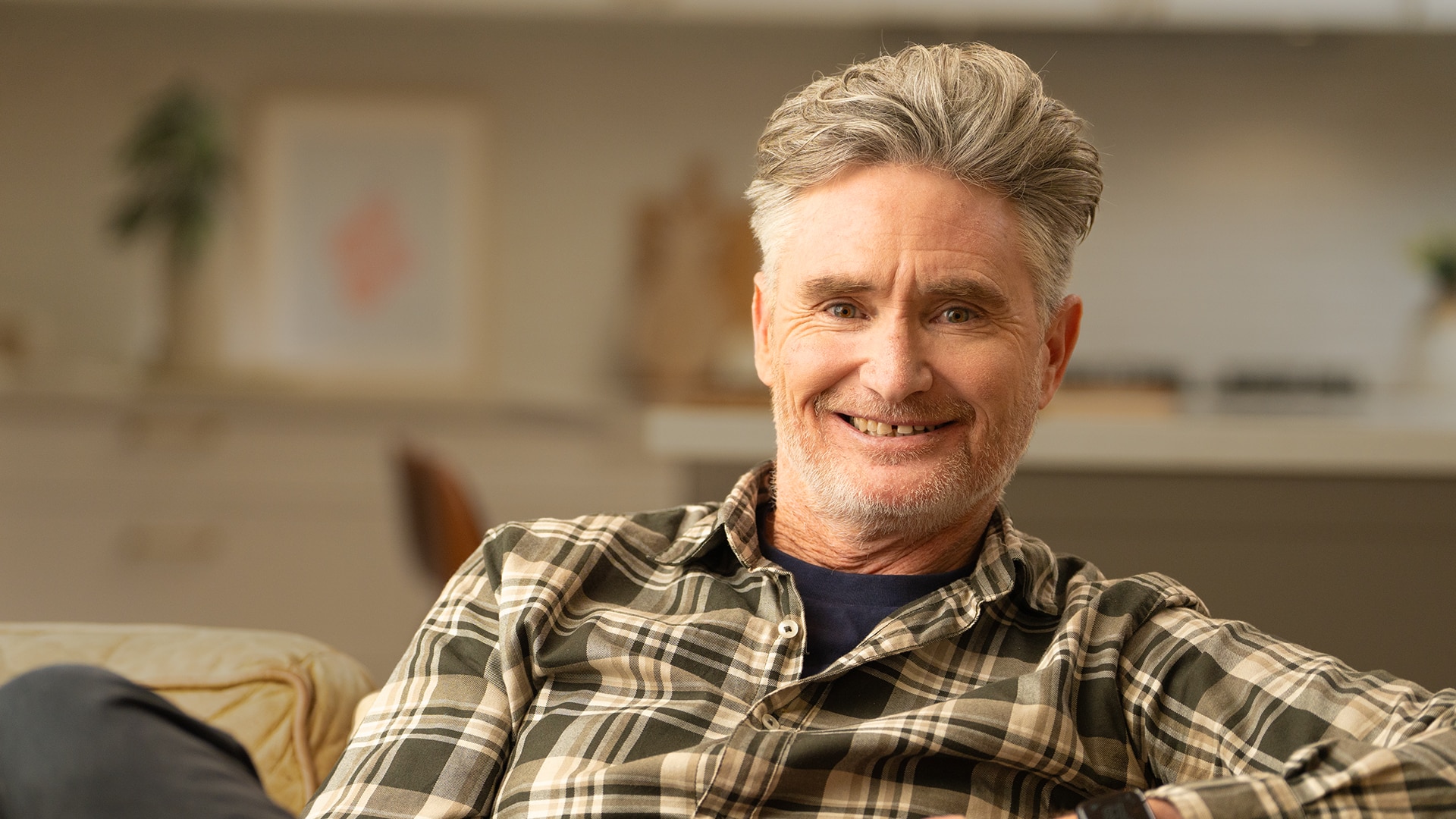 Dave Hughes seated, shoulders up, smiling