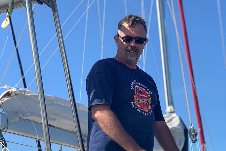 Jason Smith aboard his boat, which had to be turned around amid high seas.