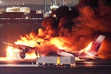Plane in flames on tarmac