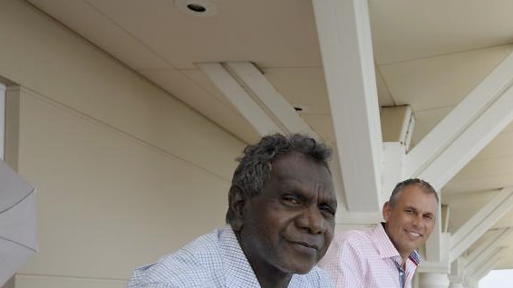 Former Palmer United Party member Francis Kurrupuwu stands alongside NT Chief Minister Adam Giles