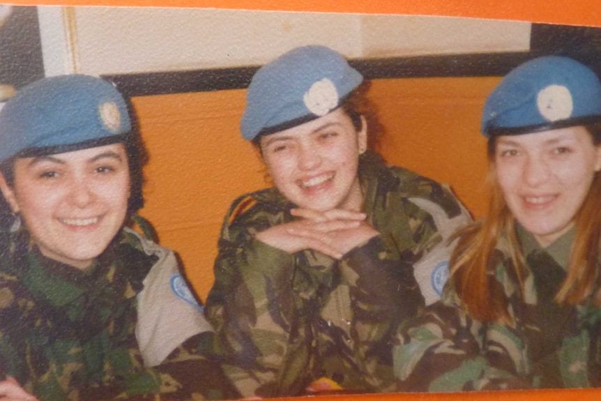 An archival photo of three women in UN uniform.