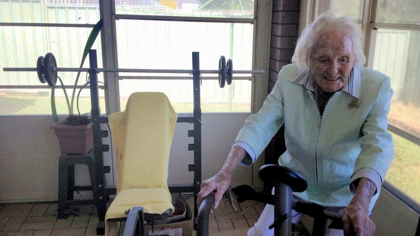 Ruth Frith, who is still a competing athlete, marks her 104th birthday with a ride on her exercise bike