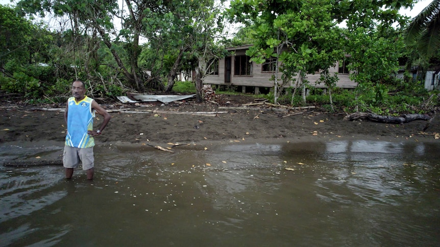 A man in knee-deep water.