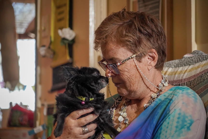 A woman with a chihuahua