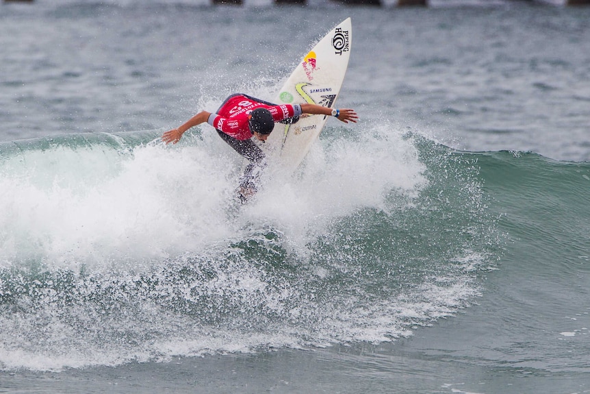 Sally Fitzgibbons surfs at the US Open