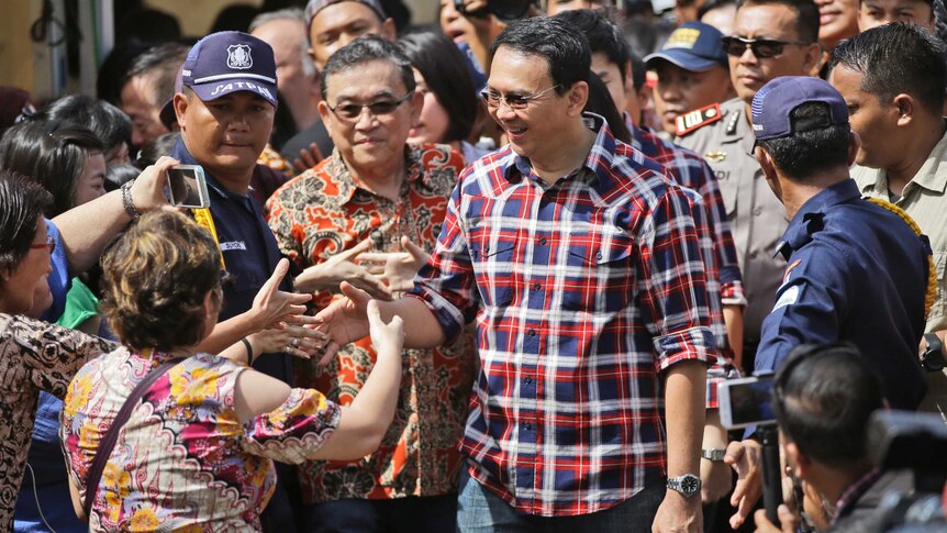 Jakarta Governor Basuki "Ahok" Tjahaja Purnama greets supporters on election day.