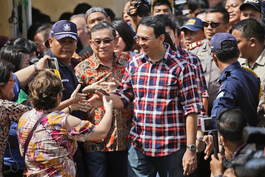 Jakarta Governor Basuki "Ahok" Tjahaja Purnama greets supporters on election day.