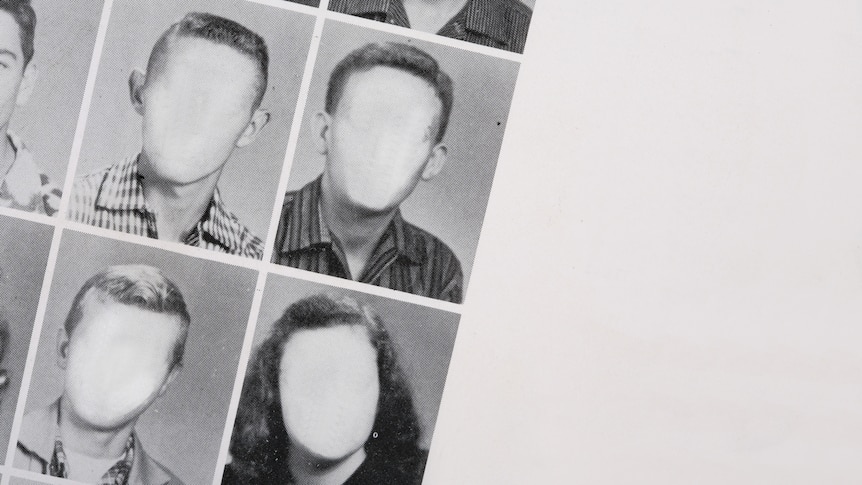 Black and white image of a high school year book, with the faces of the students removed to be blank.