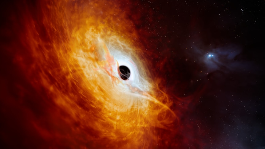 An artist rendering of a black hole inside a mass of fiery red and orange material.