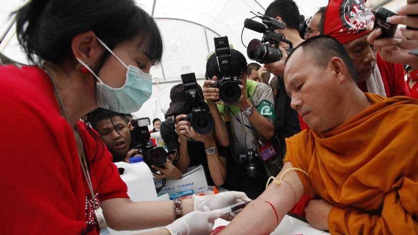 A Buddhist monk donates blood as supporters of former prime minister Thaksin Shinawatra prepare for the symbolic protest.