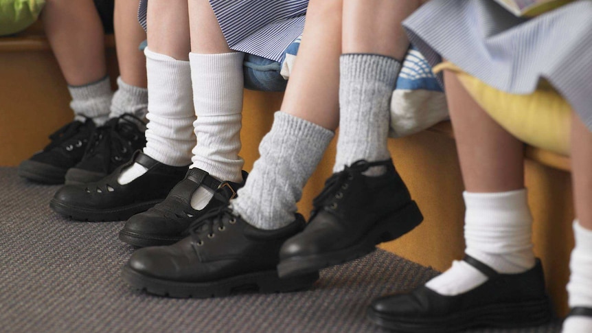 Row of school kids in school shoes