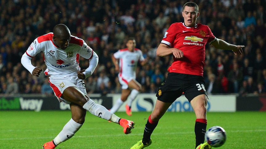 Afobe scores as MK Dons shock Manchester United