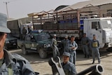 An Afghan policeman mans a weapon