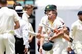 England captain Joe Root shakes hands with Australian batsman David Warner after Australia won on Day 5 at the Gabba.