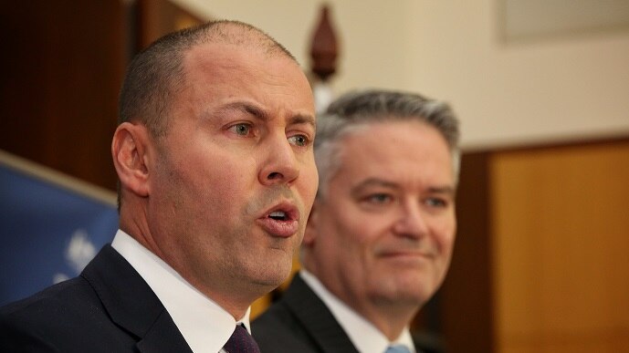 Josh Frydenberg delivers the federal budget on April 2, 2019 while Mathias Corman stands next to him.