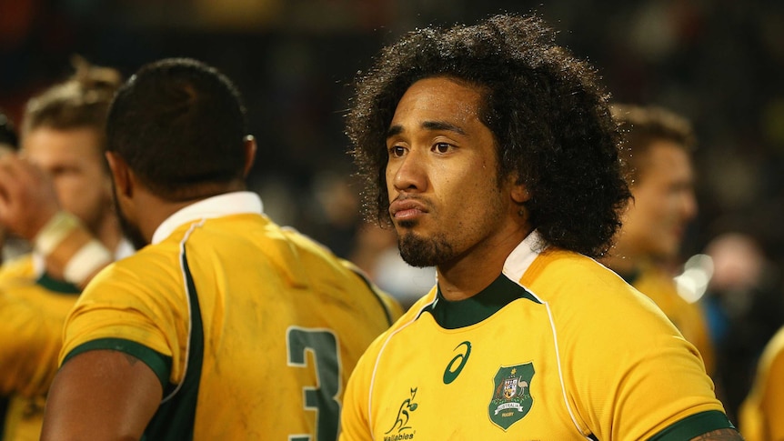 The Wallabies' Joe Tomane looks on