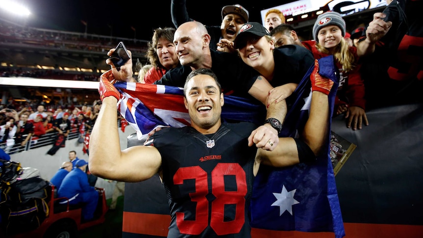 Jarryd Hayne celebrates with 49ers fans after debut win