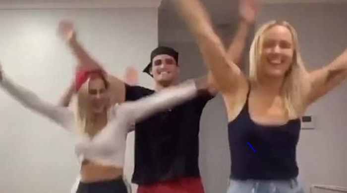 A video screenshot shows Nathan Cleary dancing with two women