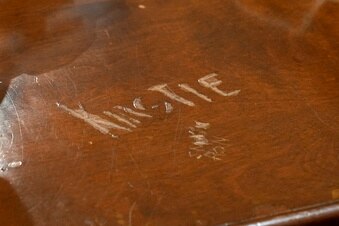 A bar top with Kirstie carved into it will be sold at an auction in the US.