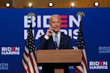 Joe Biden stands at a lectern
