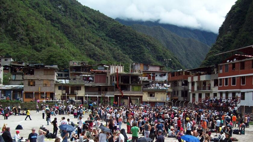 Tourists gather at a local stadium in Peru
