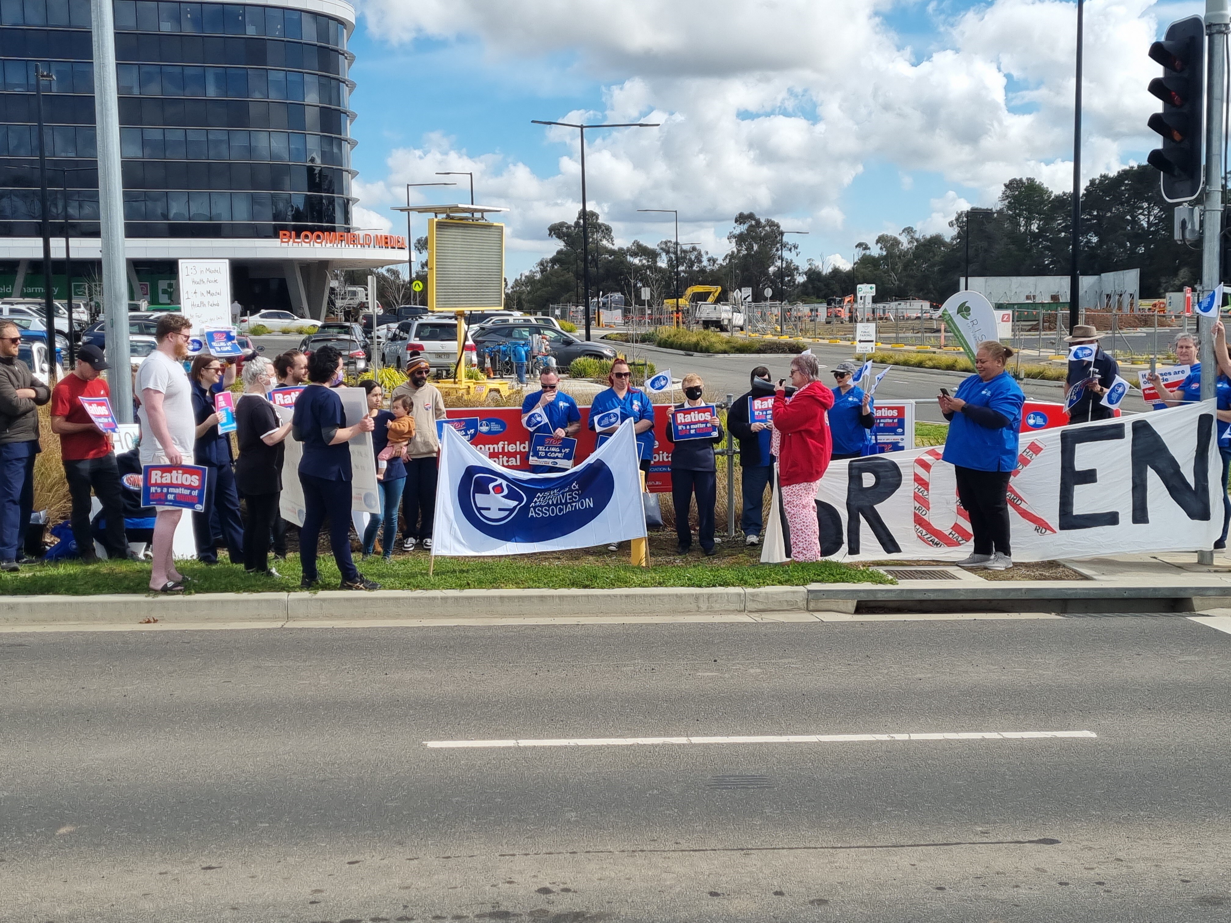 Striking nurses holding banners