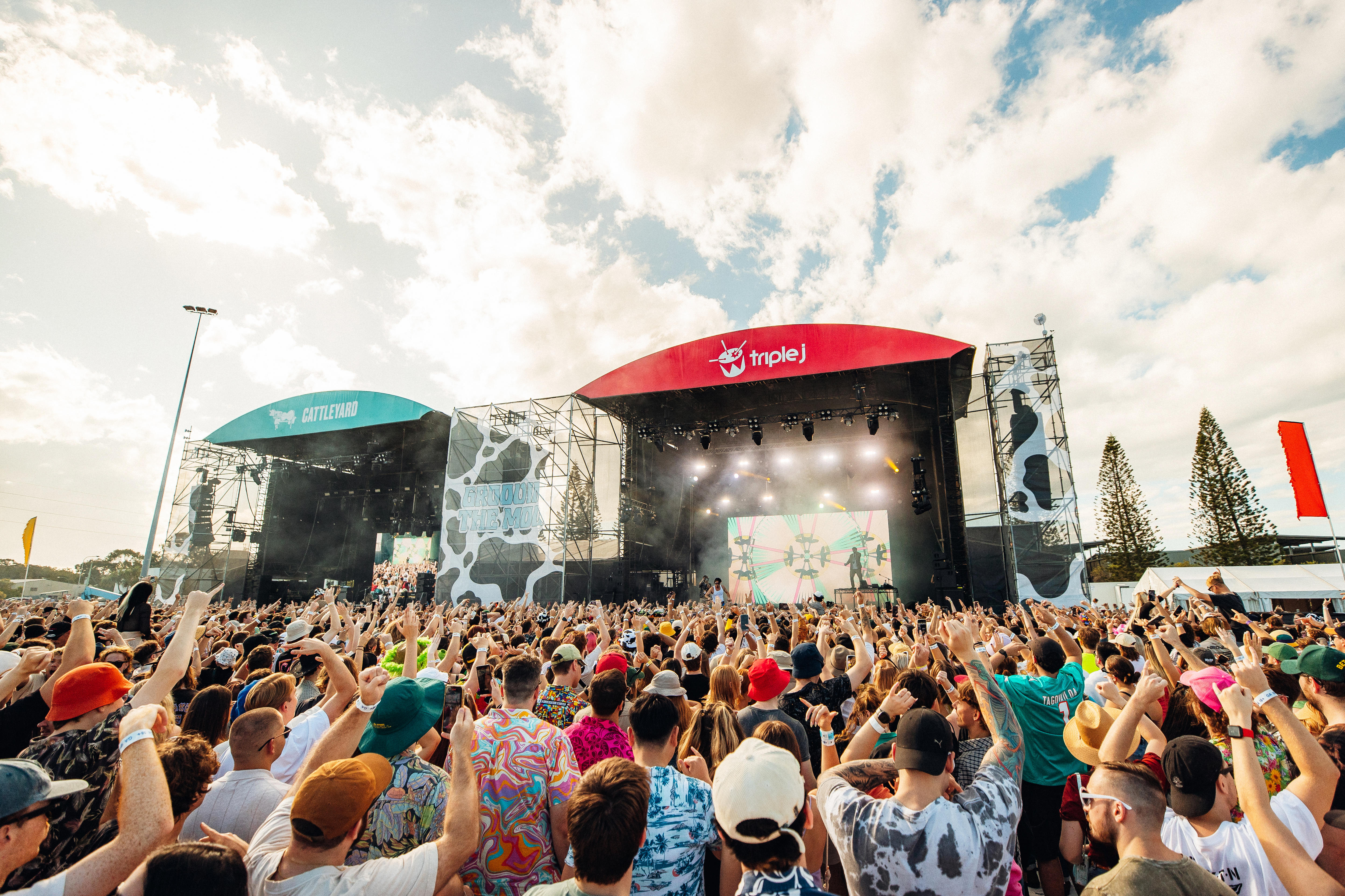 Big crowds stand in front of two outdoor stages at Groovin The Moo on the Sunshine Coast