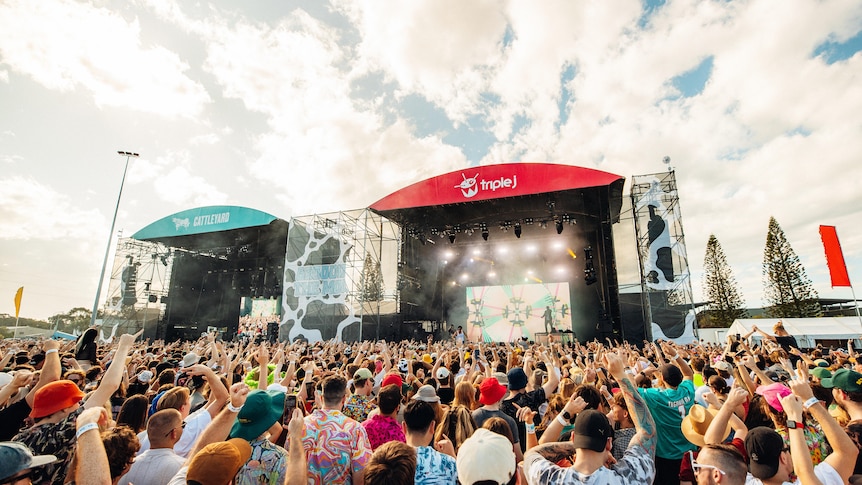 Big crowds stand in front of two outdoor stages at Groovin The Moo on the Sunshine Coast