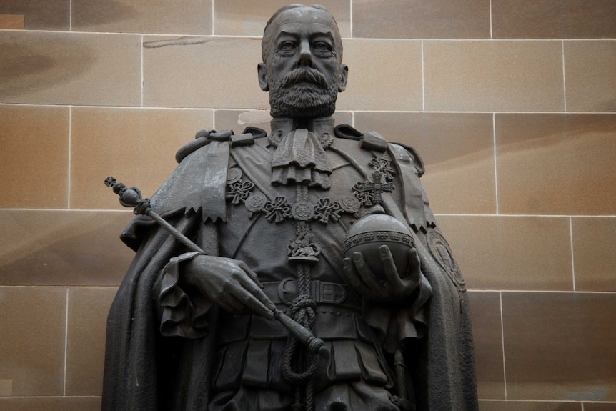 A bronze statue of King George V.