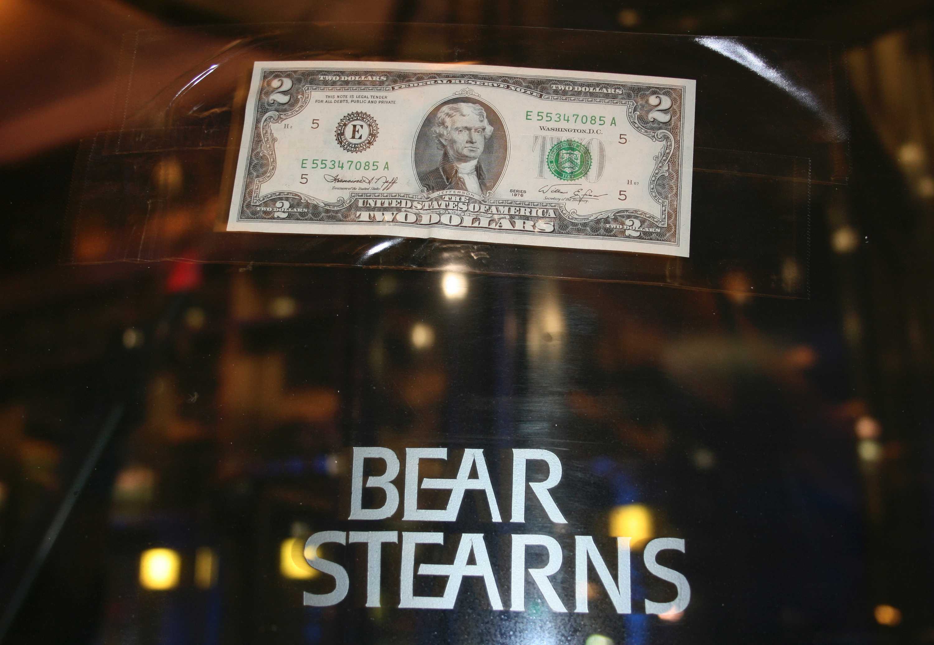 A $2 note stuck on the door of the Bear Sterns office after J.P. Morgan offered to buy the bank for $2 a share