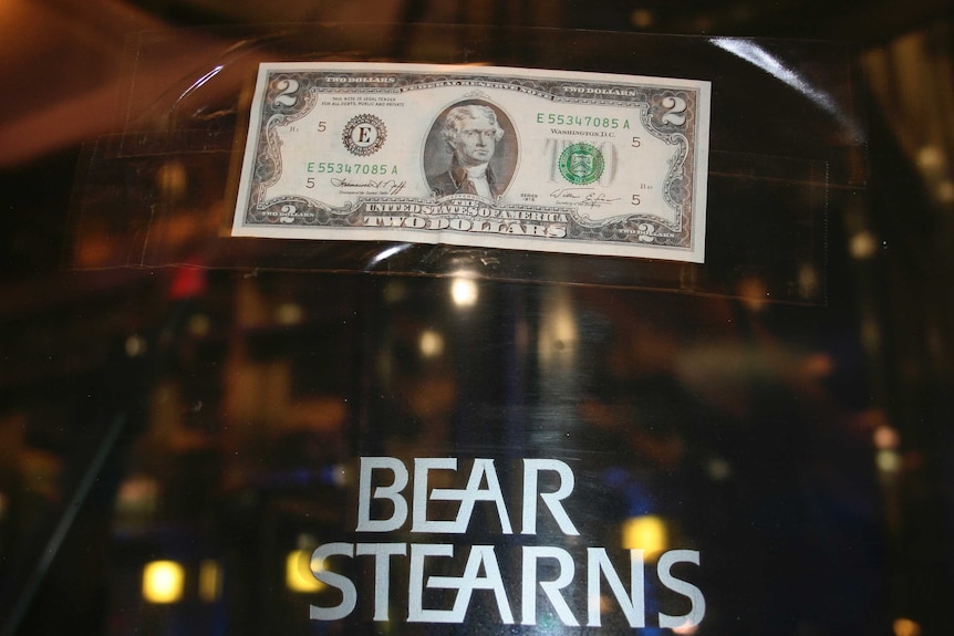 A $2 note stuck on the door of the Bear Sterns office after J.P. Morgan offered to buy the bank for $2 a share