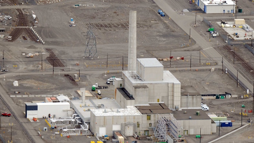 Workers demolish a decommissioned nuclear reactor during clean-up operations in Hanford, Washington state.