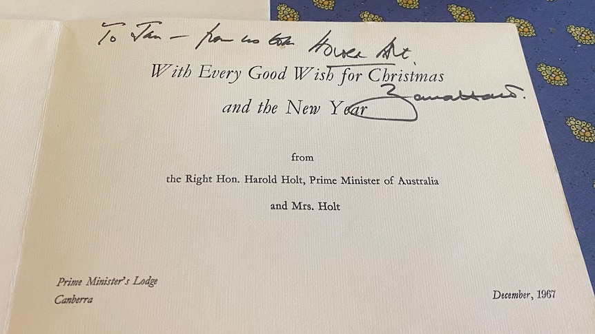 A christmas card with writing in it.