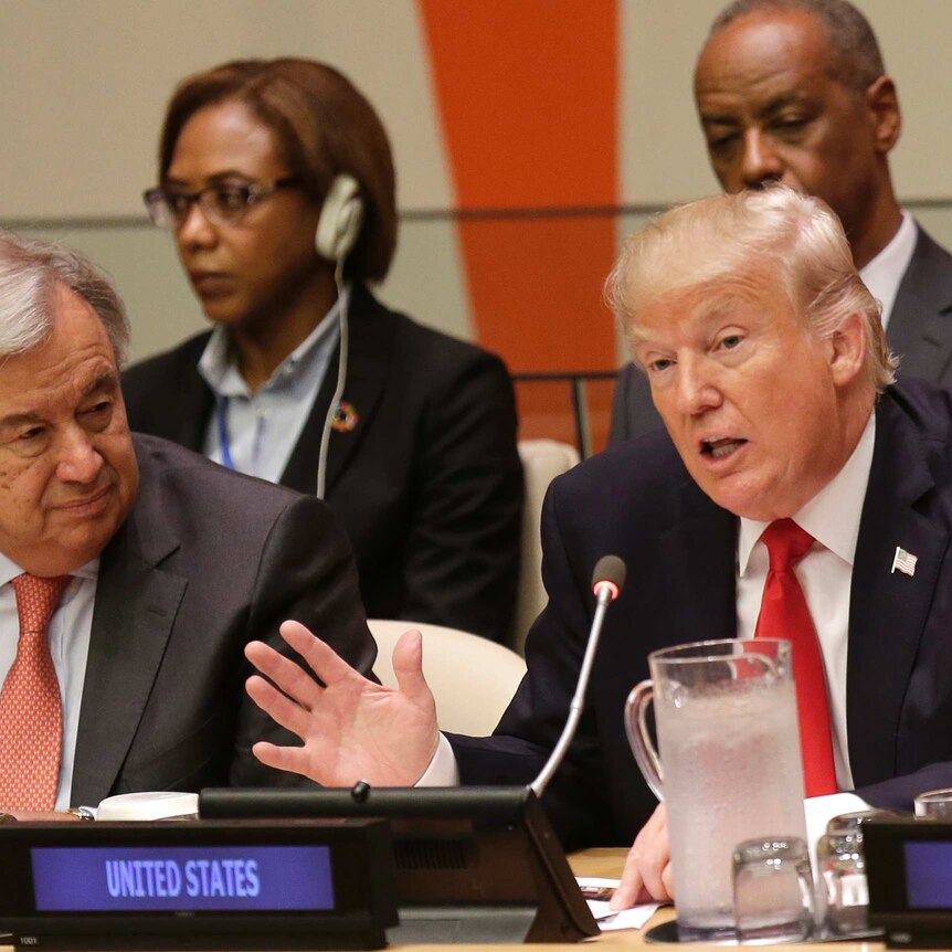 Donald Trump speaks while United Nations Secretary-General Antonio Guterres listens