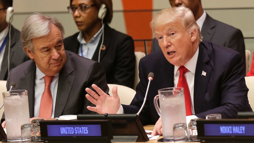 Donald Trump speaks while United Nations Secretary-General Antonio Guterres listens