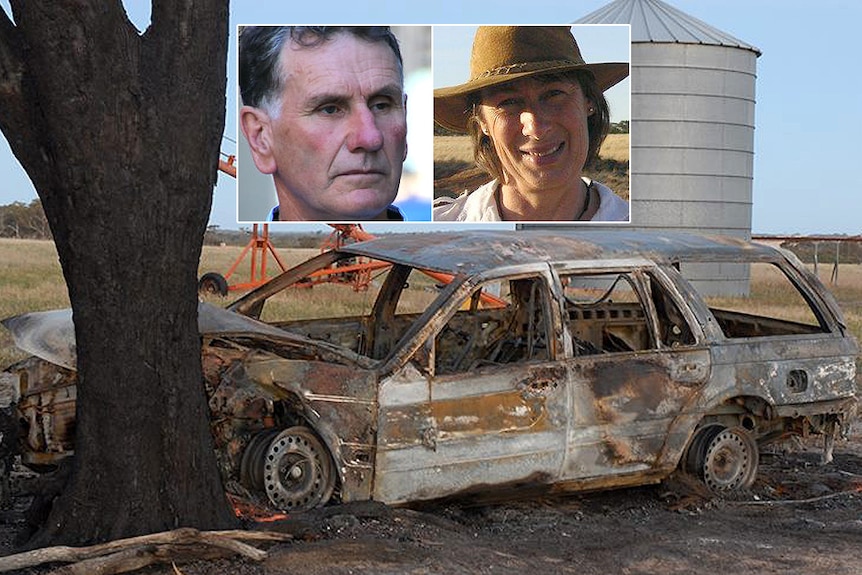 A headshot of a man in a shirt and a woman in a hat and shirt either side of a burnt car shell next to a tree on a farm.