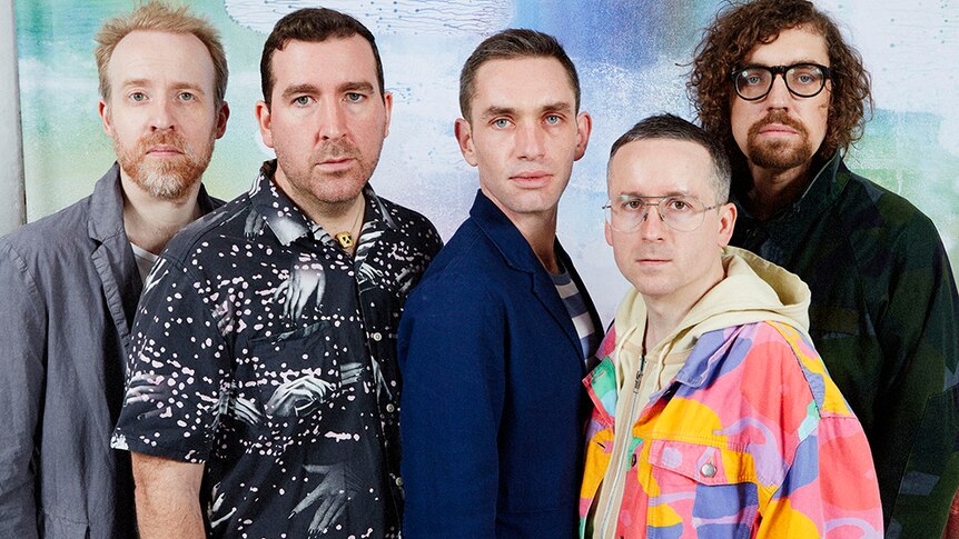 The five members of Hot Chip staring deadpan into the camera.