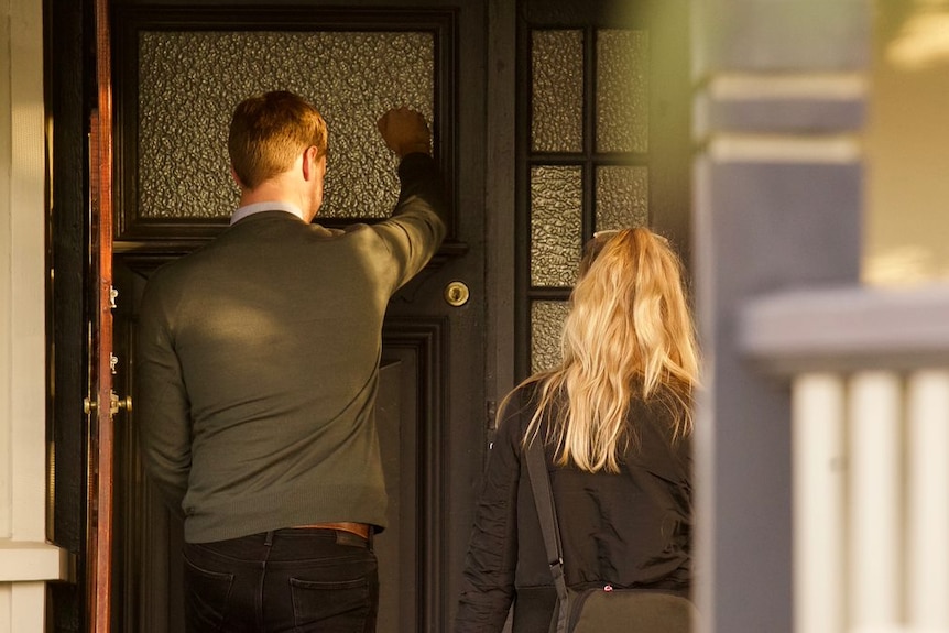 Anne-Marie Skegg and Chris Ward knock on a front door